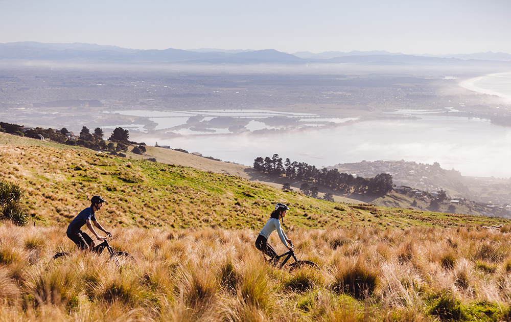 Man and Woman mountain biking in the Port Hills, Christchurch
