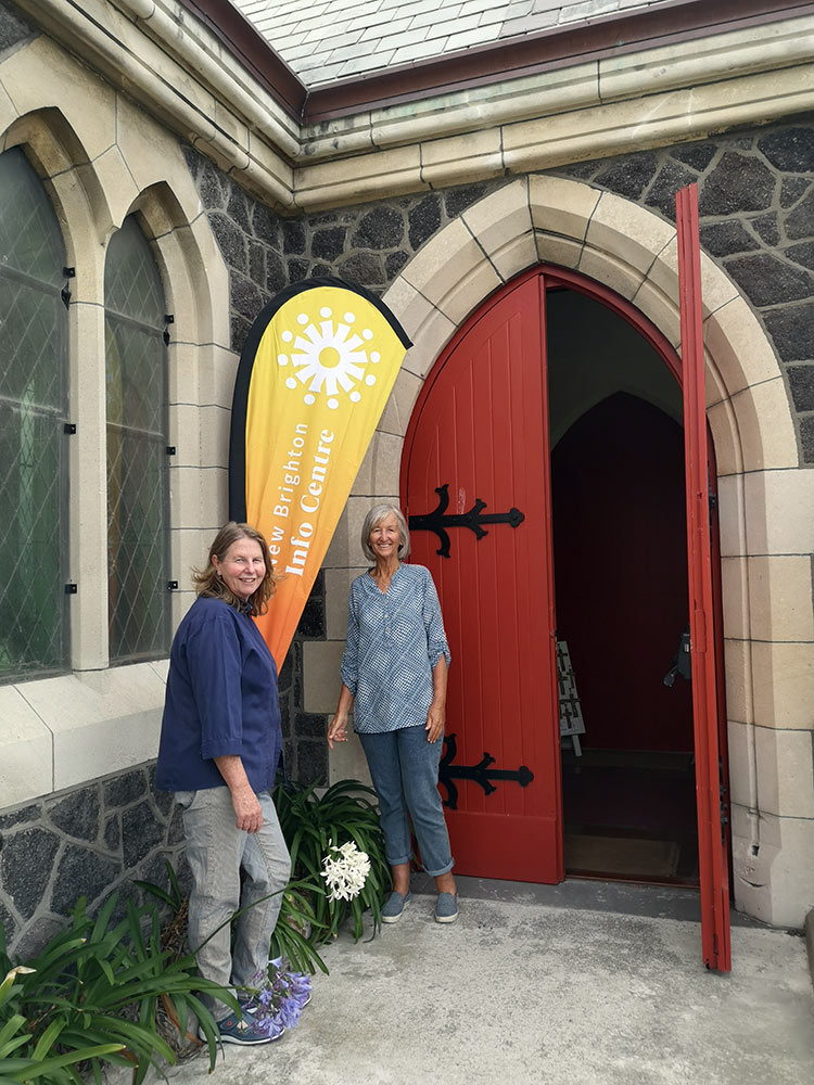 Katrina Hill and Trudy Burrows standing with New Brighton Info Centre sign at St Faiths Church