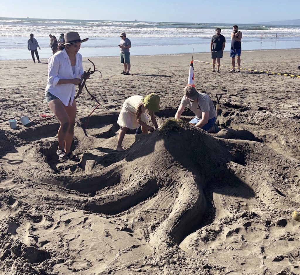 A family competing in New Brighton's Sand Castle Competition