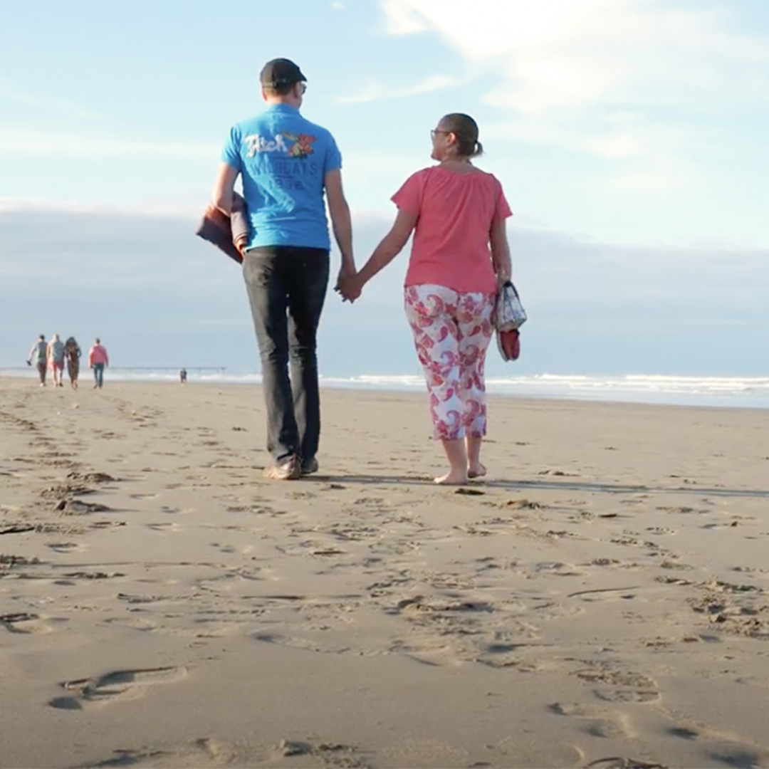 A couple walking on New Brighton Beach
