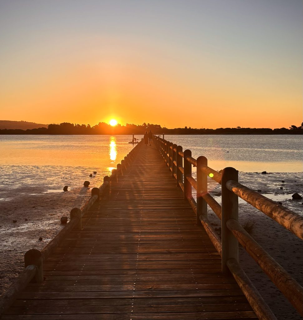 Couple walking at Sunset at South New Brighton Pier